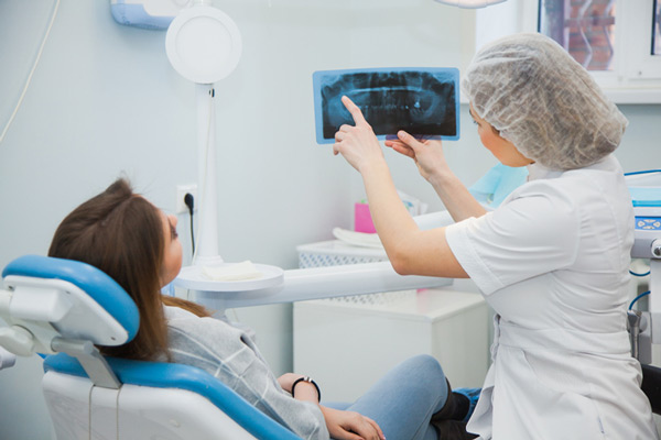 Dentist showing patient her xray at The Center for Esthetic Dentistry in Grants Pass, OR